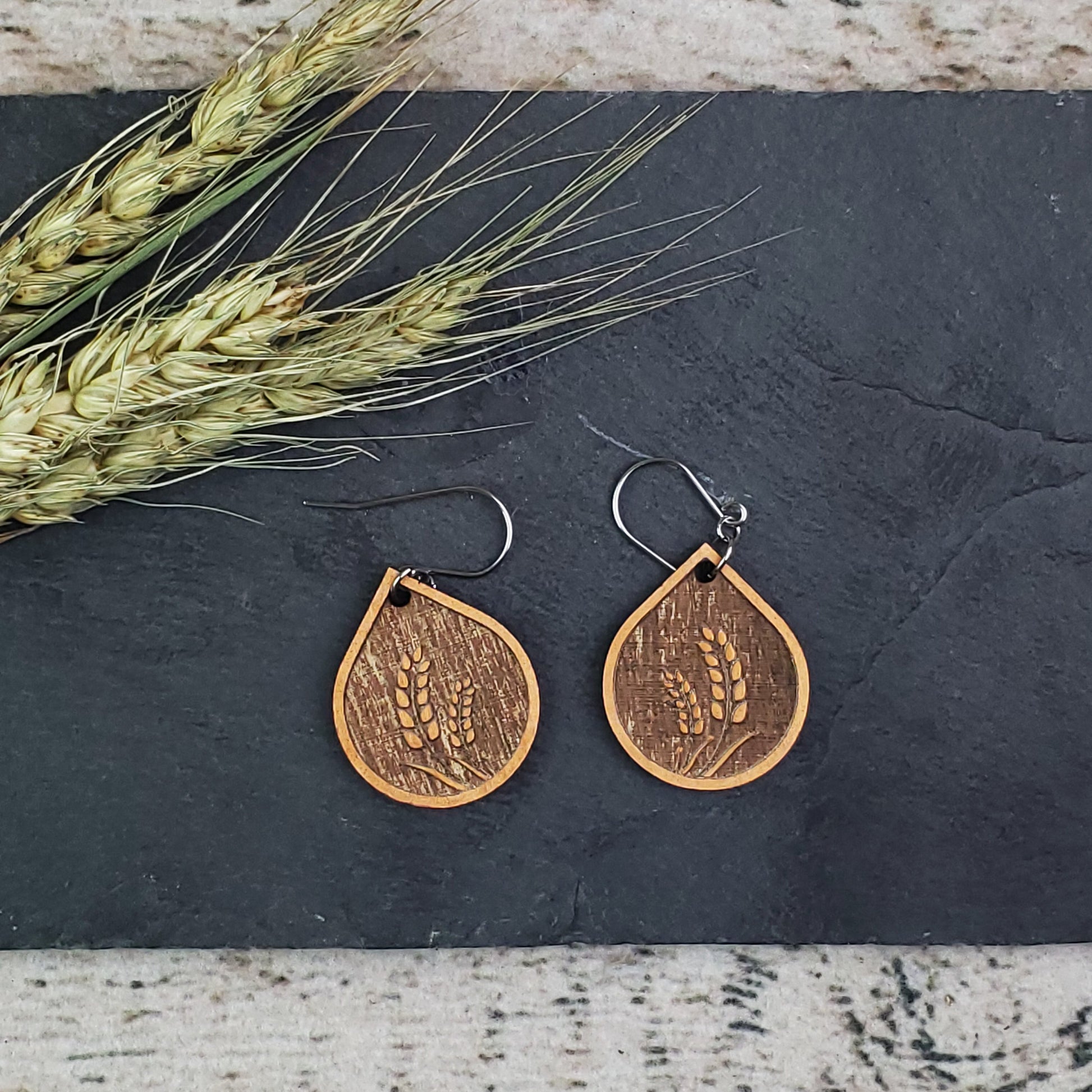 Bronze Wheat Wood Engraved Dangle Earrings - A Farm Girl by Tess | Handmade Alpaca Wool Winter Hats for Women